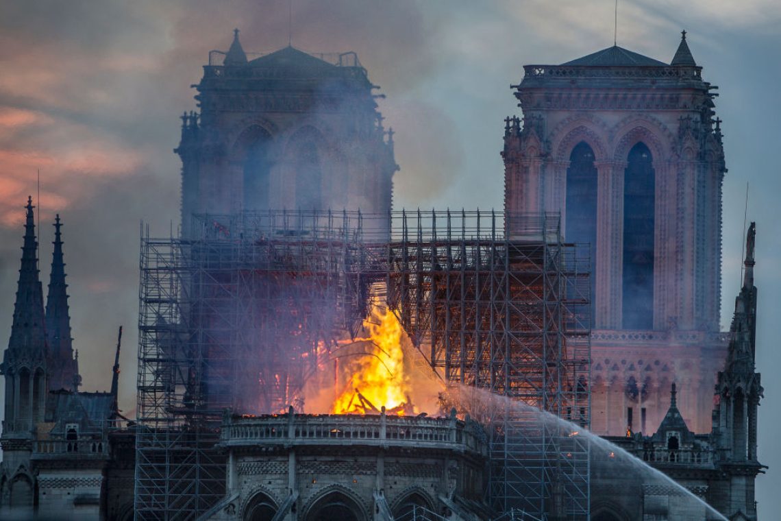 PARIS, FRANCE - APRIL 15: Smoke and flames rise from Notre-Dame Cathedral on April 15, 2019 in Paris, France. A fire broke out on Monday afternoon and quickly spread across the building, collapsing the spire. The cause is yet unknown but officials said it was possibly linked to ongoing renovation work. (Photo by Veronique de Viguerie/Getty Images)