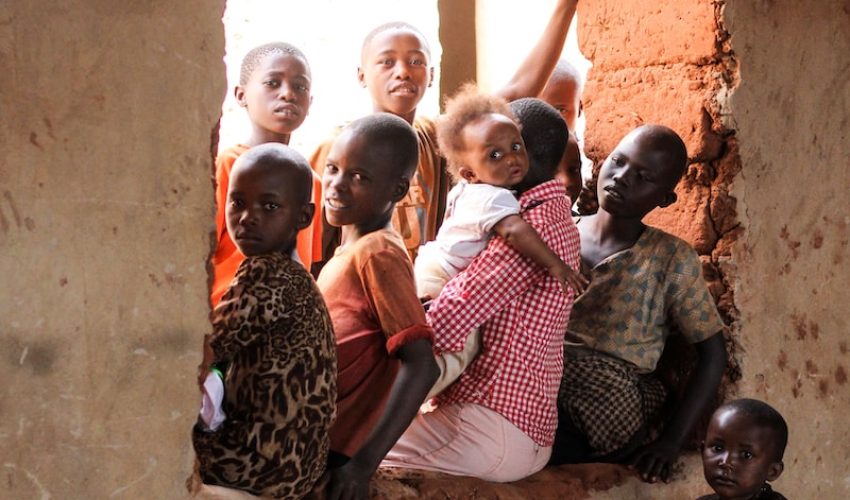 children sitting on window