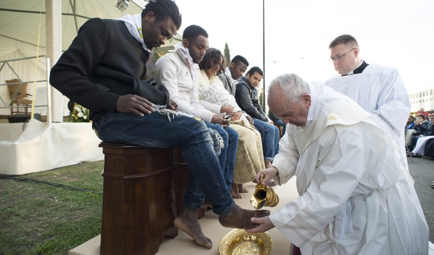 In this handout picture released by the Vatican Press Office, Pope Francis performs the foot-washing ritual at the Castelnuovo di Porto refugees center near Rome on March 24, 2016. Pope Francis washed the feet of 11 young asylum seekers and a worker at their reception centre to highlight the need for the international community to provide shelter to refugees.



Several of the asylum seekers, one holding a baby in her arms, were reduced to tears as the 79-year-old pontiff kneeled before them, pouring water over their feet, drying them with a towel and bending to kiss them. / AFP / STR / RESTRICTED TO EDITORIAL USE - MANDATORY CREDIT "AFP PHOTO / OSSERVATORE ROMANO" - NO MARKETING NO ADVERTISING CAMPAIGNS - DISTRIBUTED AS A SERVICE TO CLIENTS