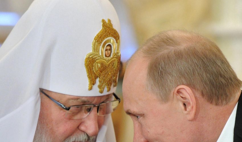 FILE - In this Wednesday, Feb. 8, 2012 file photo, Russian Prime Minister Vladimir Putin, right, speaks with Russian Orthodox Patriarch Kirill during his meeting with Russia's religious leaders in the St. Daniel Monastery in Moscow. Critics have said that the church lost its impartiality when Kirill signaled his support for Prime Minister and presidential candidate Vladimir Putin shortly before the March vote. (AP Photo/RIA-Novosti, Yana Lapikova, Government Press Service)