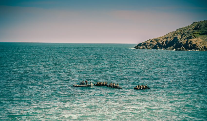 people on boat on sea during daytime